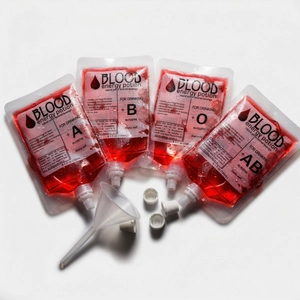 Close-up of Halloween blood drink pouches with funnels and assorted blood type labels