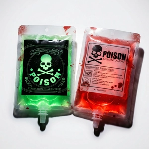 Close-up of 250ml Halloween poison and blood IV bags with red and green liquids and skull prints
