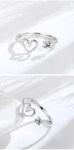 Detail of S925 silver open ring featuring a hollow heart and zircon stone inlay
