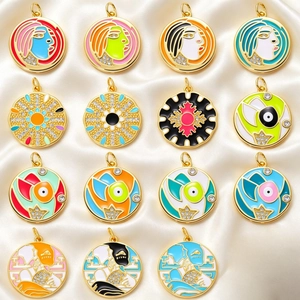 Bohemian gold plated enamel pendants with sun, evil eye and abstract art designs