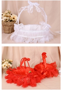 Detail of white and red wedding flower baskets with lace bows and satin ribbons