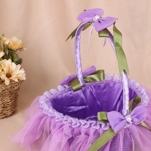 Handmade purple satin wedding flower girl basket with lace trim and bow decorations