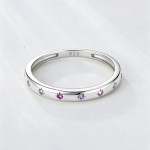 Detail of 925 sterling silver ring featuring engraved hallmark and purple zircon stars