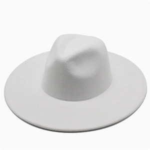 Top view of white wide-brim felt fedora hat with classic indented crown for autumn fashion