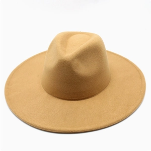 Detail view of the smooth texture and flat brim of a camel wool fedora jazz hat