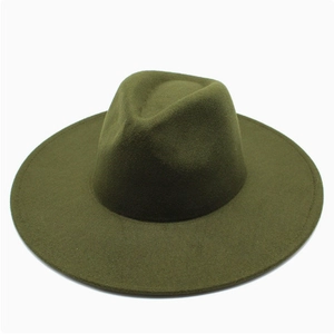 Close-up of deep green wool fedora hat with a wide flat brim and classic indented crown