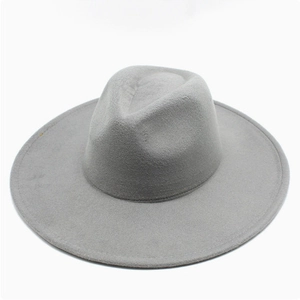 Close-up of a premium grey wide-brim wool fedora hat with a classic flat crown design