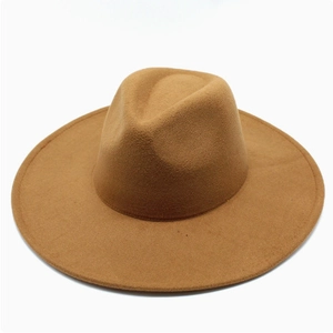 Top-down view of a brown wide-brim wool fedora hat with classic indented crown design