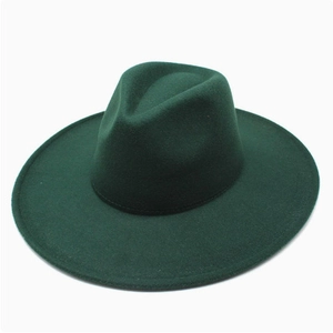 Close-up detail showing the dark green wool felt texture of this wide brim fedora hat