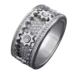 Macro shot of silver mechanical gear ring with multi-row pavé set white cubic zirconia