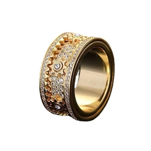 Macro detail of golden mechanical gear ring with full pave diamond settings