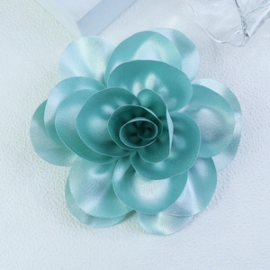 Detail of 14cm mint blue satin camellia brooch with metallic silk texture for suits