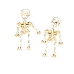 Golden skeleton earrings with white pearl inlay in a creative punk fashion style