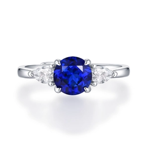 Macro detail of S925 silver ring with large blue sapphire and side stones