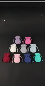 Detail of colorful double-sided velvet gourd pouches with double drawstrings in nine colors