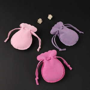 Three colorful velvet drawstring jewelry pouches for rings and earrings storage