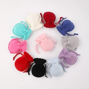 Colorful double-sided velvet drawstring jewelry pouches with decorative scalloped edges