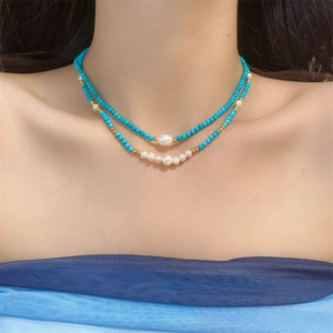 Double-layered turquoise and freshwater pearl necklace with golden accent beads