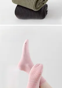 Detail of non-slip silicone grip pads on sole of cotton yoga socks for fitness