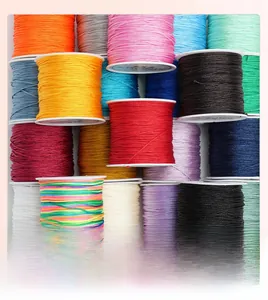 Macro shot of 72 jade thread spools in vibrant colors for DIY jewelry and braided bracelets