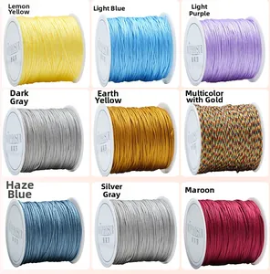 Macro display of nine colorful spools of high-gloss nylon cords for DIY jewelry weaving