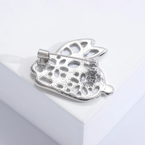Detailed back view of silver rabbit brooch showing secure pin fastener and metal texture