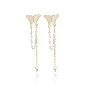 Detailed view of butterfly tassel earrings with pearls and diamond-cut crystals