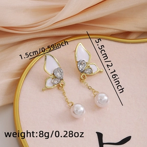 Detail of butterfly pearl tassel earrings showing dimensions 1.5cm width and 5.5cm length