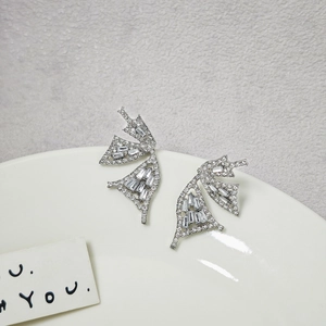 Detailed view of silver butterfly earrings with sparkling cubic zirconia wing setting