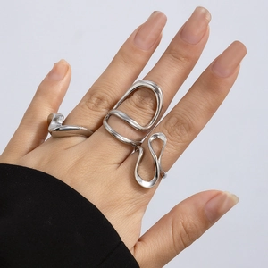 Close-up of liquid metal style silver rings with irregular lava shapes on model hand