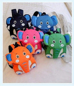 Detail of five colorful cartoon elephant backpacks for toddlers in bright playground colors
