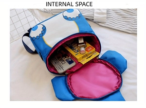 Internal view of blue children backpack with pink lining showing storage capacity