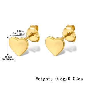 Detail shot of heart-shaped gold studs with S925 silver hallmarks and butterfly backs