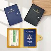 Detail of PU leather passport holder featuring gold embossed text and card slots