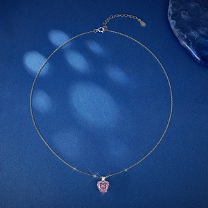 Detailed view of S925 sterling silver stamp on clasp of pink heart pendant necklace