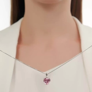 Close-up of S925 silver necklace featuring a faceted pink heart-shaped zircon pendant