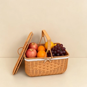 Detail of woven picnic basket with white lace trim, pearl bow, and dual lids