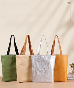 Eco-friendly Tyvek shopping bags in four colors with textured finish and soft shadows