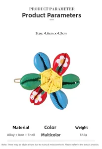 Macro detail of tropical shell flower hair clip with colorful lacquer floral patterns