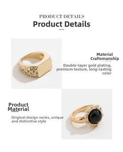 Detail of gold-plated signet ring and vintage black gemstone ring with double plating