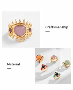 Detail of vintage style gold plated rings with pink heart gemstone and turquoise inlay