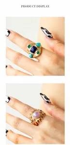 Detail of vintage gold rings featuring turquoise and tiger eye stone settings