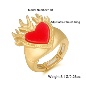 Vintage style gold adjustable heart ring with red flame design and elastic band