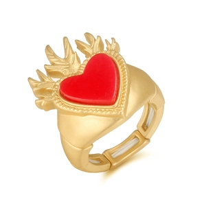 Vintage matte gold ring with red heart inlay and ornate carved wings on white backdrop