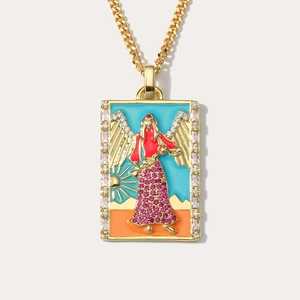 Close-up of golden tarot temperance pendant necklace with colorful enamel and zircon stones