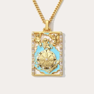 Detail of gold tarot Wheel of Fortune pendant with blue enamel and zircon inlay