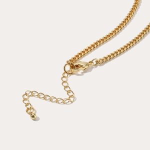 Detail view of gold tarot necklace featuring a sturdy lobster clasp and adjustable extension chain