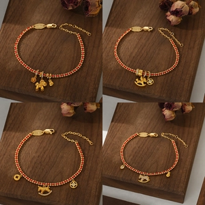 2026 Year of the Horse red string bracelet with gold zodiac horse charms and lobster clasp