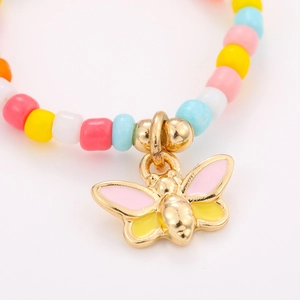 Handmade colorful bead ring set with a gold butterfly charm for women in summer style