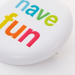 Rainbow 'have fun' text on a white metal round button badge with back pin fastener
